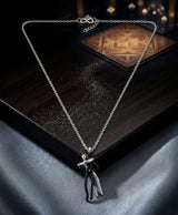 Silver-Tone Black Figure Pendant Necklace