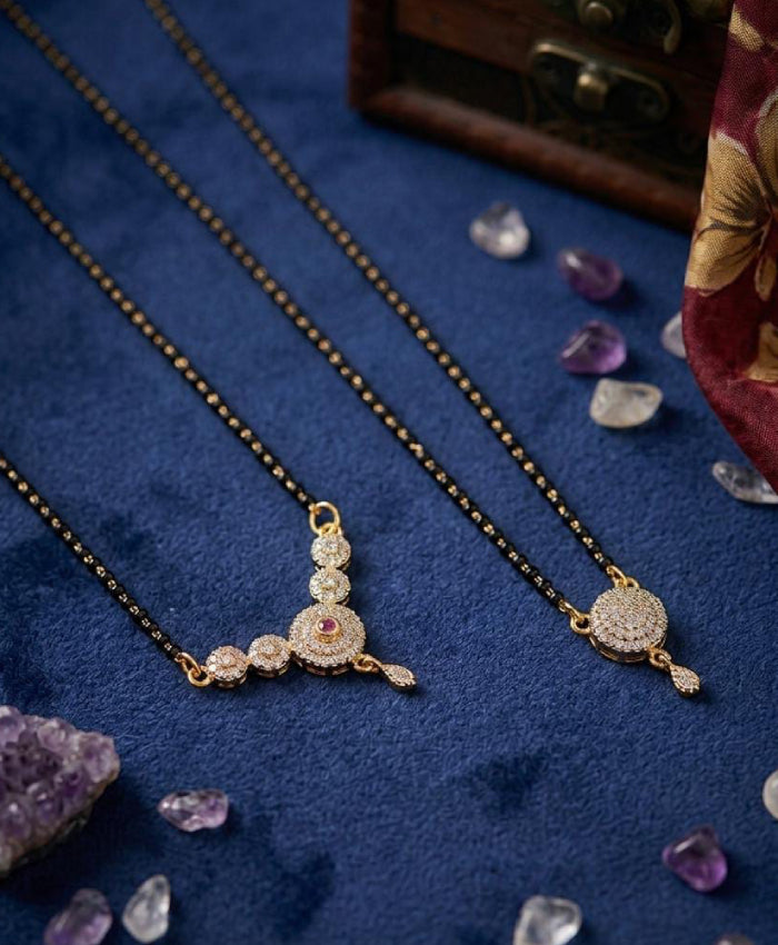 Elegant black-beaded mangalsutra set with graceful golden-tone pendants