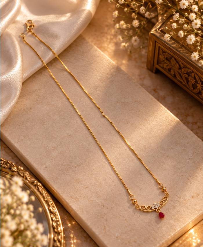 Elegant Gold-Tone Filigree Necklace with Red Teardrop Accent