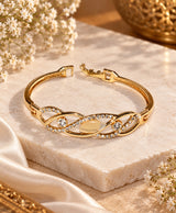 Elegant Gold-Tone Crystal Studded Open Bangle – Infinity-Inspired Statement Bracelet