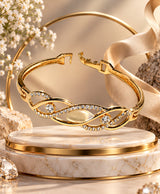 Elegant Gold-Tone Crystal Studded Open Bangle – Infinity-Inspired Statement Bracelet