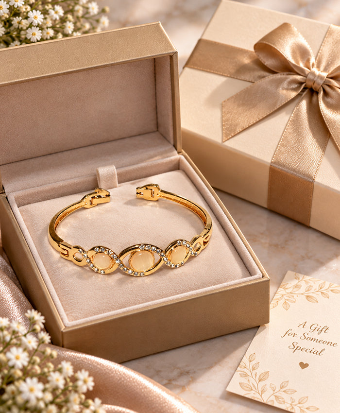 Elegant Gold-Tone Triple Oval Crystal Bangle – Champagne Stone Statement Bracelet for Women