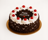 Red Roses, White Lilies & Black Forest Anniversary Celebration Combo