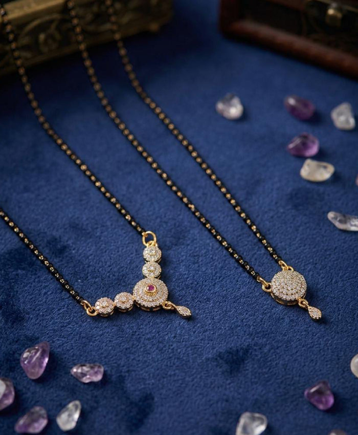 Elegant black-beaded mangalsutra set with graceful golden-tone pendants