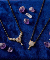 Elegant black-beaded mangalsutra set with graceful golden-tone pendants