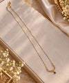 Elegant Gold-Tone Filigree Necklace with Red Teardrop Accent