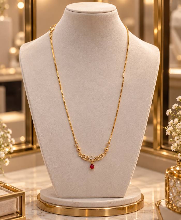 Elegant Gold-Tone Filigree Necklace with Red Teardrop Accent