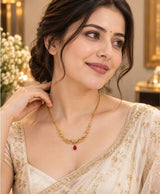 Elegant Gold-Tone Filigree Necklace with Red Teardrop Accent