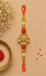 Golden Floral Designer Rakhi with Pearl & Red Beads