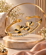 Golden Floral Crystal Cuff Bracelet – Elegant Gold-Tone Flower & Rhinestone Bangle