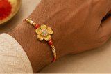 Golden Floral Designer Rakhi with Pearl & Red Beads