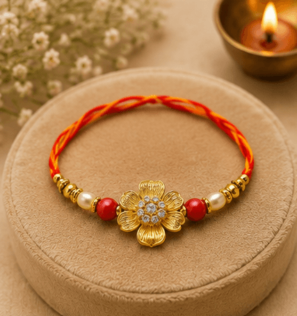 Golden Floral Designer Rakhi with Pearl & Red Beads